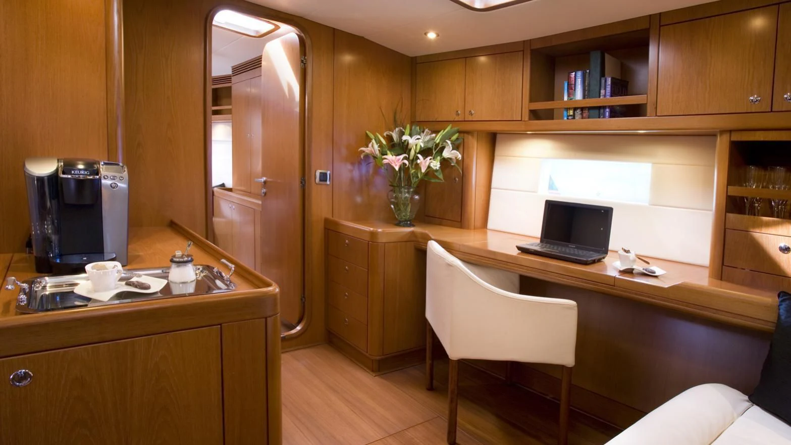 a kitchen with a large wooden cabinet aboard THIRTY NINE Yacht for Sale