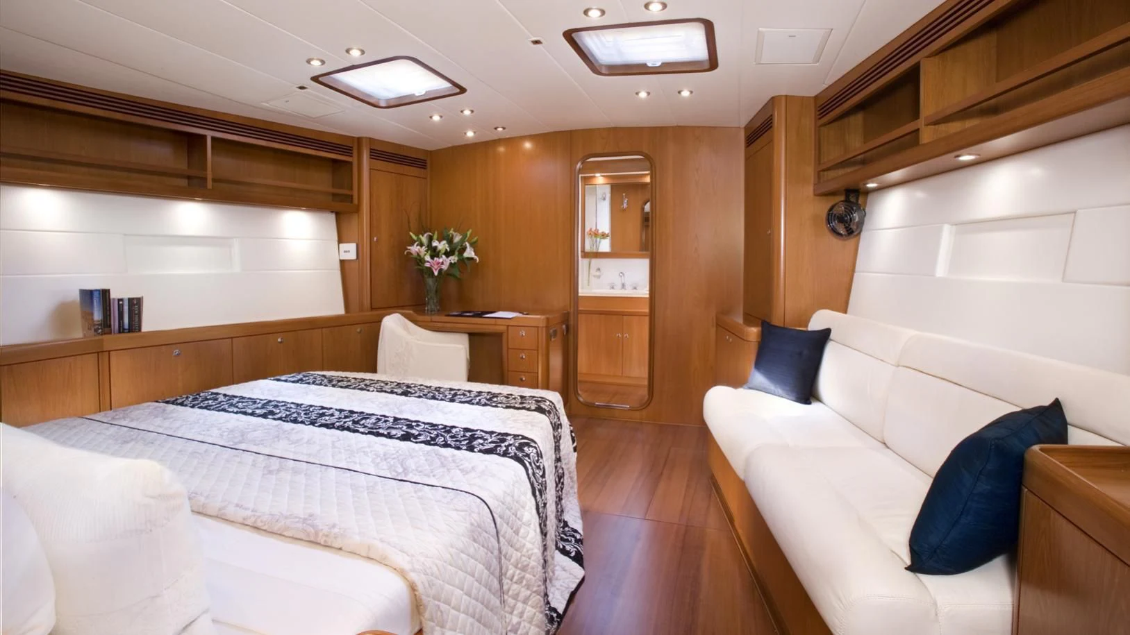 a room with a bed and a couch aboard THIRTY NINE Yacht for Sale