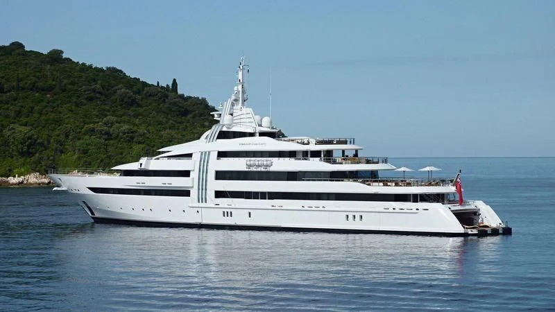 a white yacht on the water aboard VIBRANT CURIOSITY Yacht for Sale