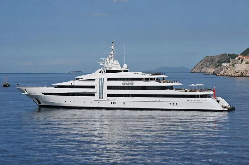 a white yacht in the water aboard VIBRANT CURIOSITY Yacht for Sale