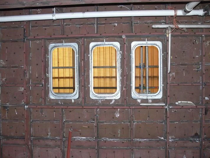 a couple of windows in a brick building aboard VIBRANT CURIOSITY Yacht for Sale