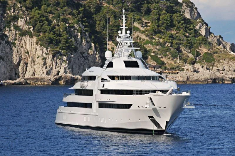 a white yacht in the water aboard VIBRANT CURIOSITY Yacht for Sale