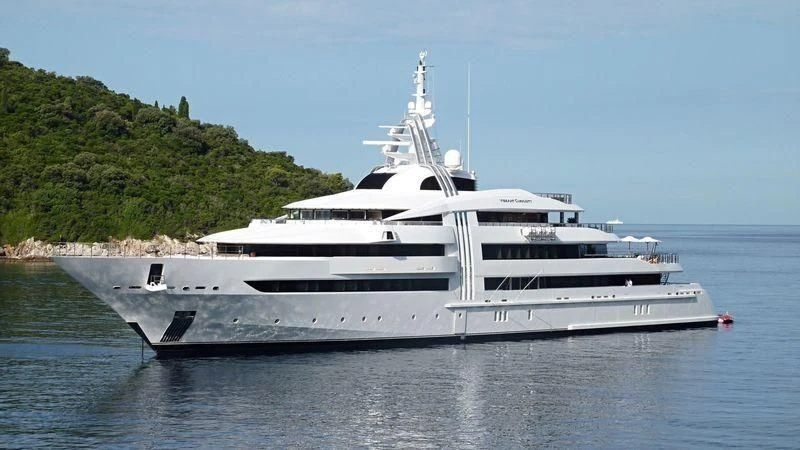 a white yacht on the water aboard VIBRANT CURIOSITY Yacht for Sale