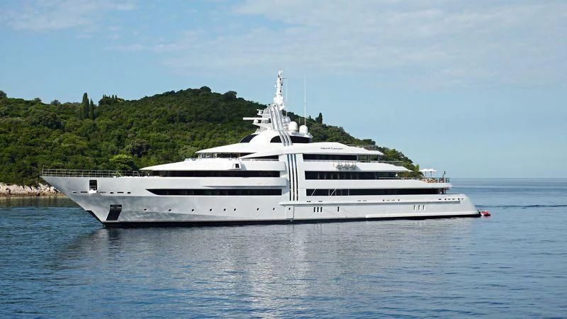 a white yacht in the water aboard VIBRANT CURIOSITY Yacht for Sale
