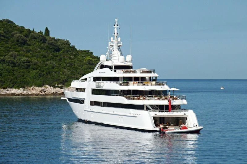 a white boat in the water aboard VIBRANT CURIOSITY Yacht for Sale