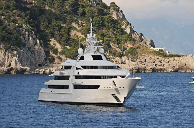 a white yacht in the water aboard VIBRANT CURIOSITY Yacht for Sale