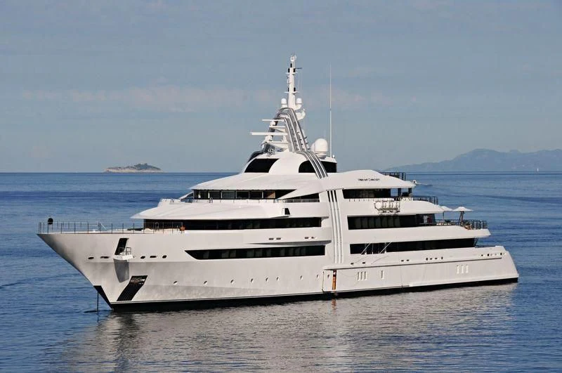 a large white yacht in the water aboard VIBRANT CURIOSITY Yacht for Sale