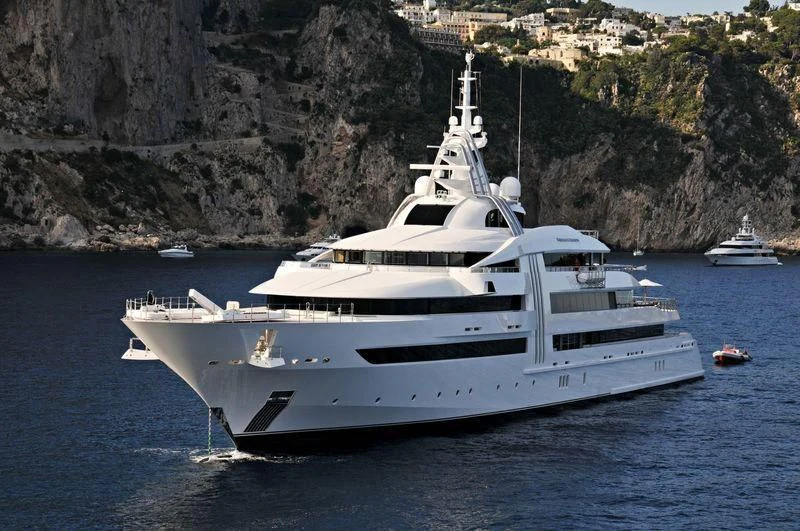 a white yacht in the water aboard VIBRANT CURIOSITY Yacht for Sale