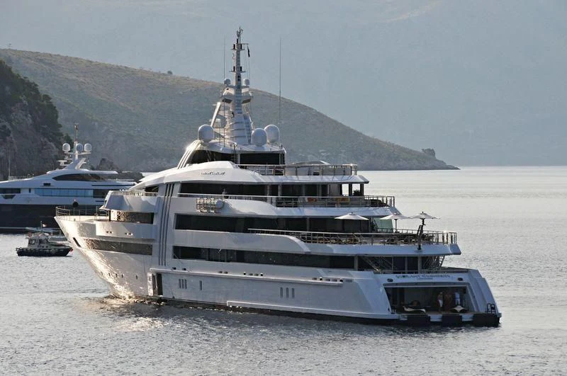 a large ship in the water aboard VIBRANT CURIOSITY Yacht for Sale