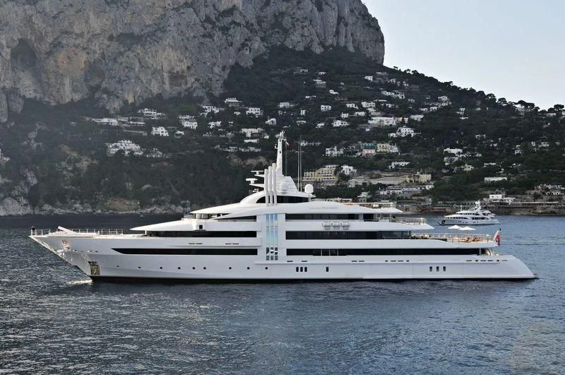a large white boat in the water aboard VIBRANT CURIOSITY Yacht for Sale