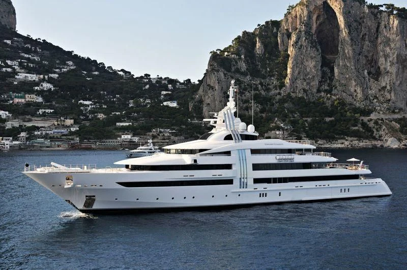 a white yacht in the water aboard VIBRANT CURIOSITY Yacht for Sale