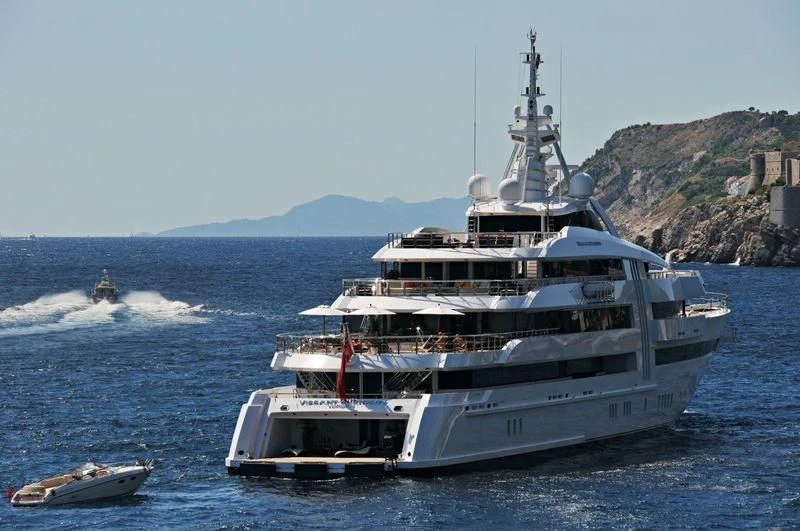 a large ship in the water aboard VIBRANT CURIOSITY Yacht for Sale