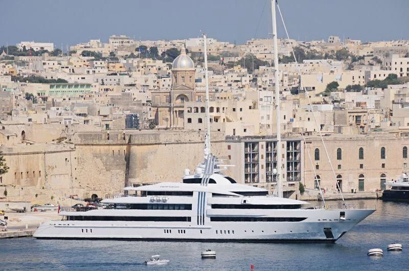 a large white boat in the water aboard VIBRANT CURIOSITY Yacht for Sale