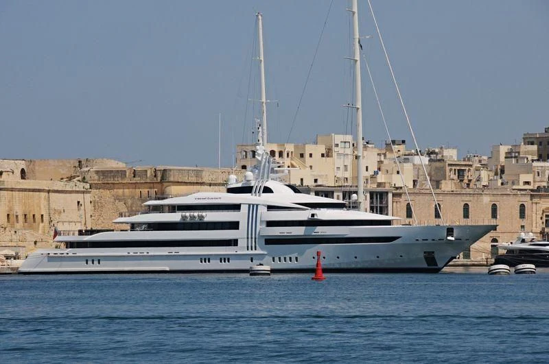 a white boat in the water aboard VIBRANT CURIOSITY Yacht for Sale