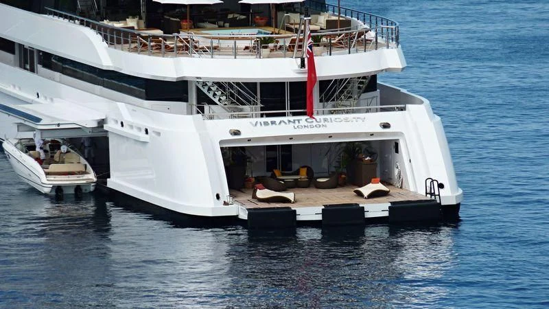 a large white boat in the water aboard VIBRANT CURIOSITY Yacht for Sale