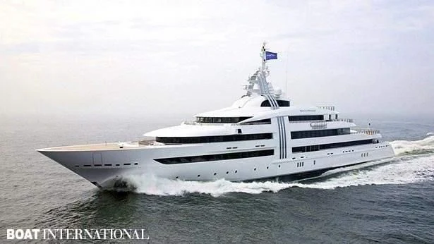 a large ship in the water aboard VIBRANT CURIOSITY Yacht for Sale