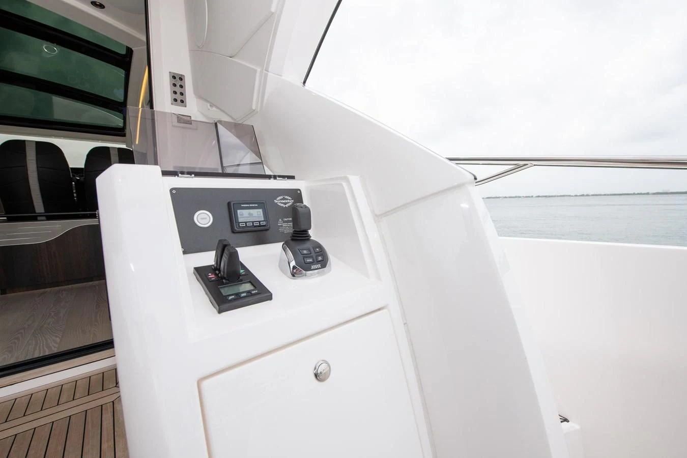 a white car with a black dial aboard INCENTIVIZED Yacht for Sale