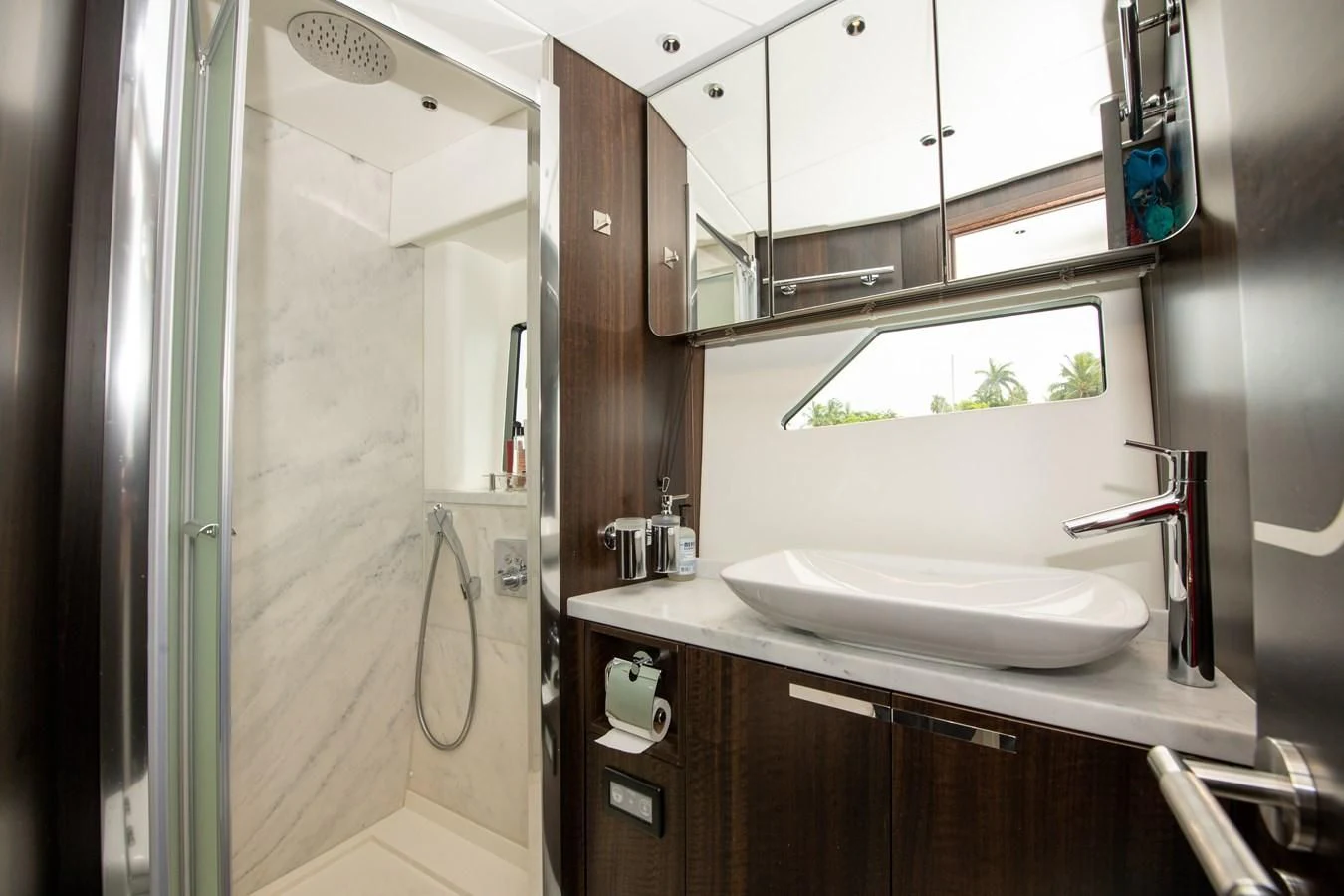 a bathroom with a sink and a mirror aboard INCENTIVIZED Yacht for Sale
