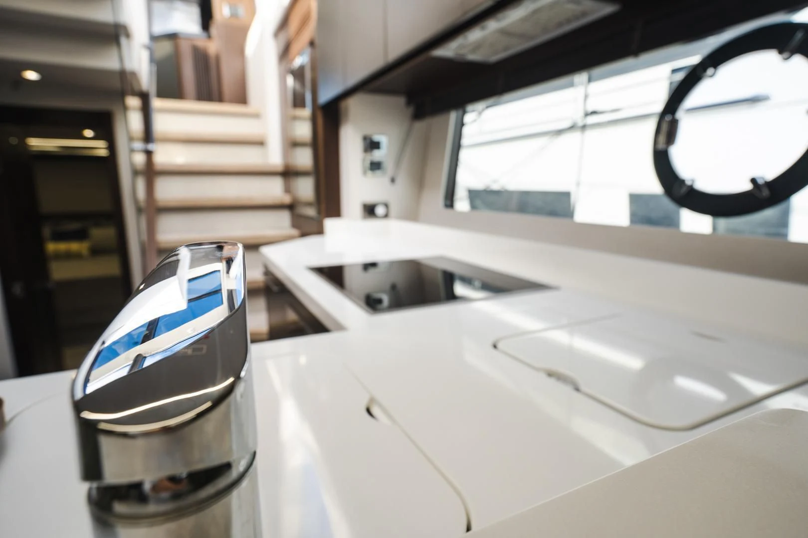 a silver cup on a white table aboard INCENTIVIZED Yacht for Sale