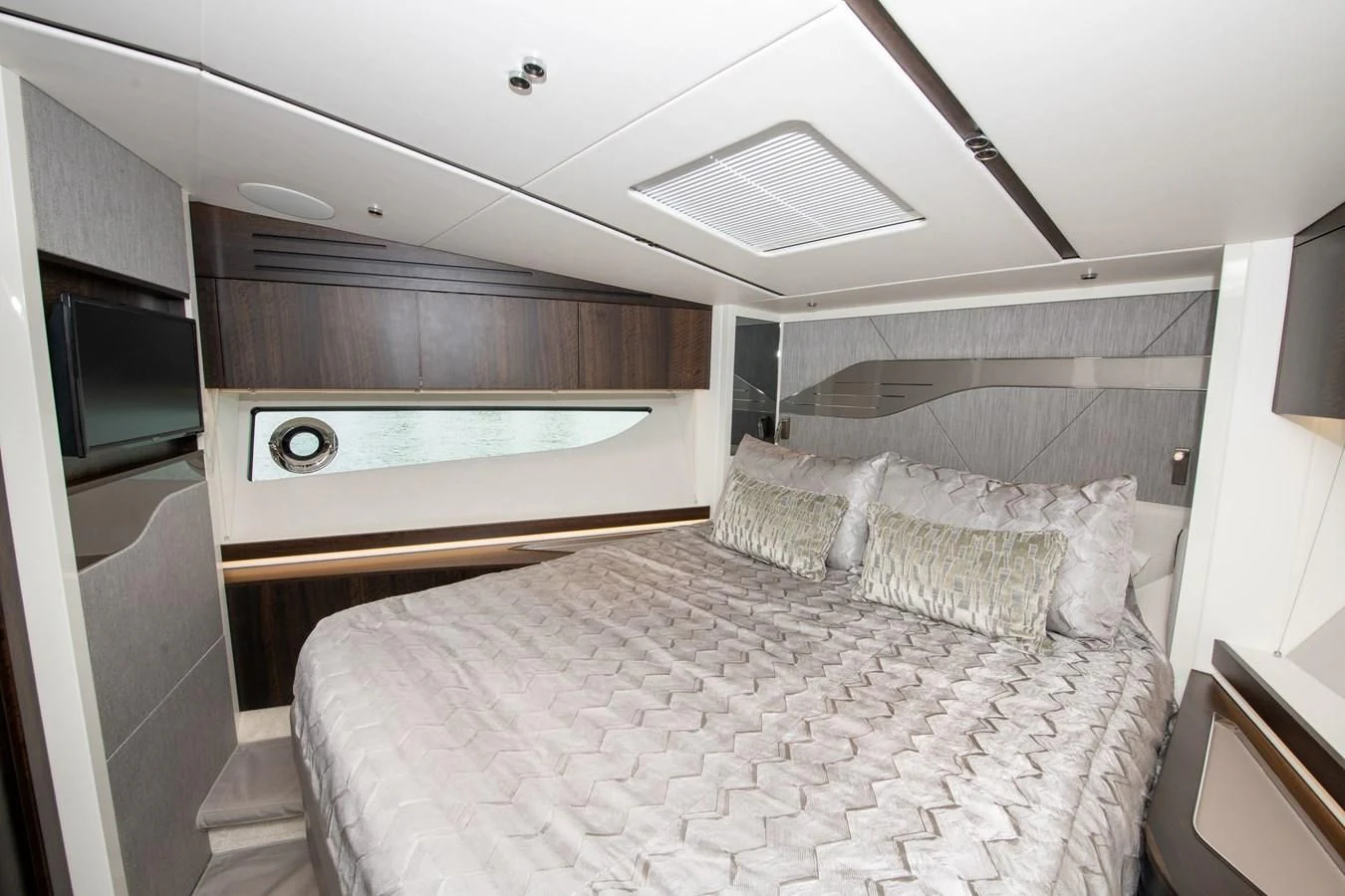 a bedroom with a bed aboard INCENTIVIZED Yacht for Sale