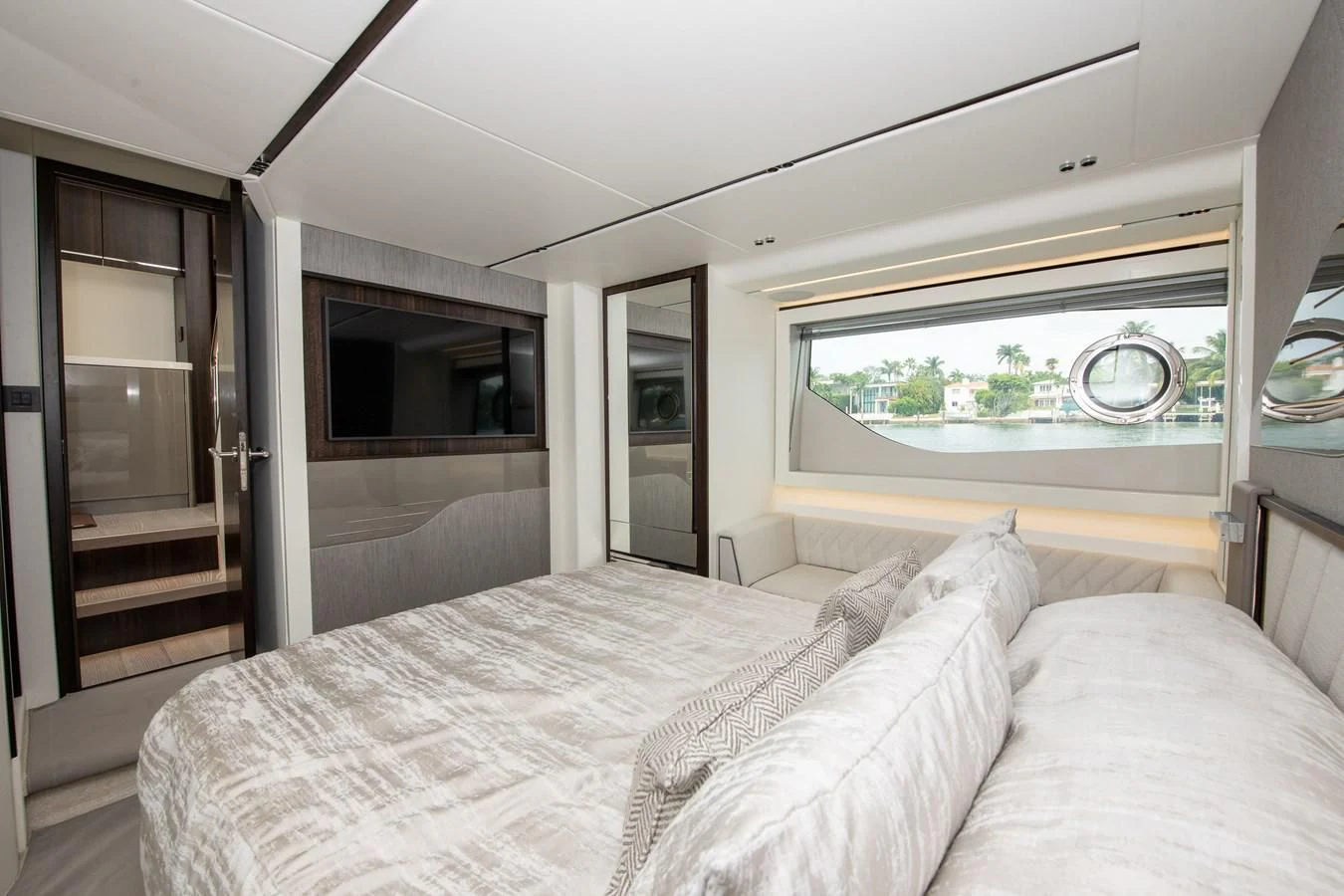 a bedroom with a large bed aboard INCENTIVIZED Yacht for Sale