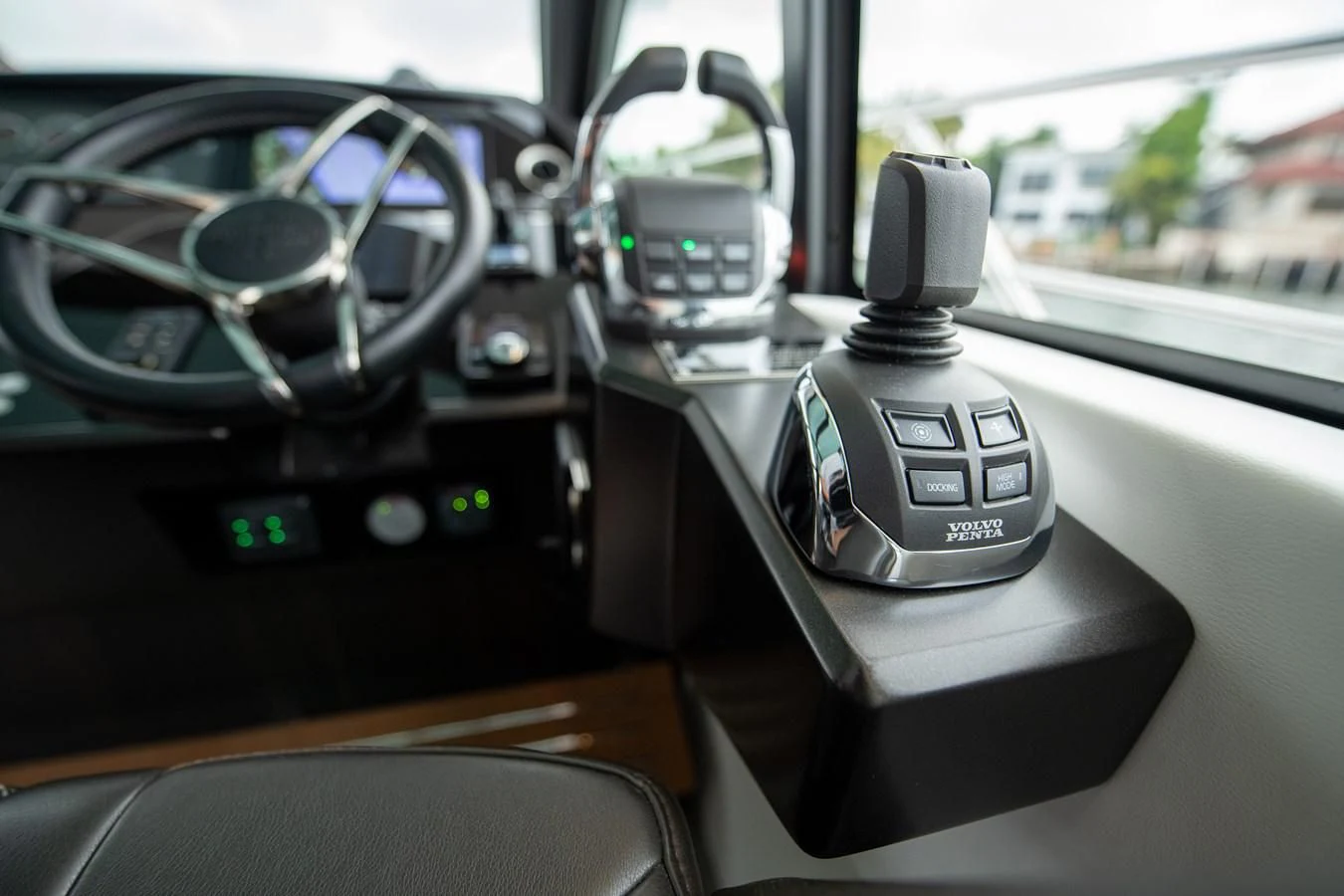 a car dashboard with a steering wheel aboard INCENTIVIZED Yacht for Sale