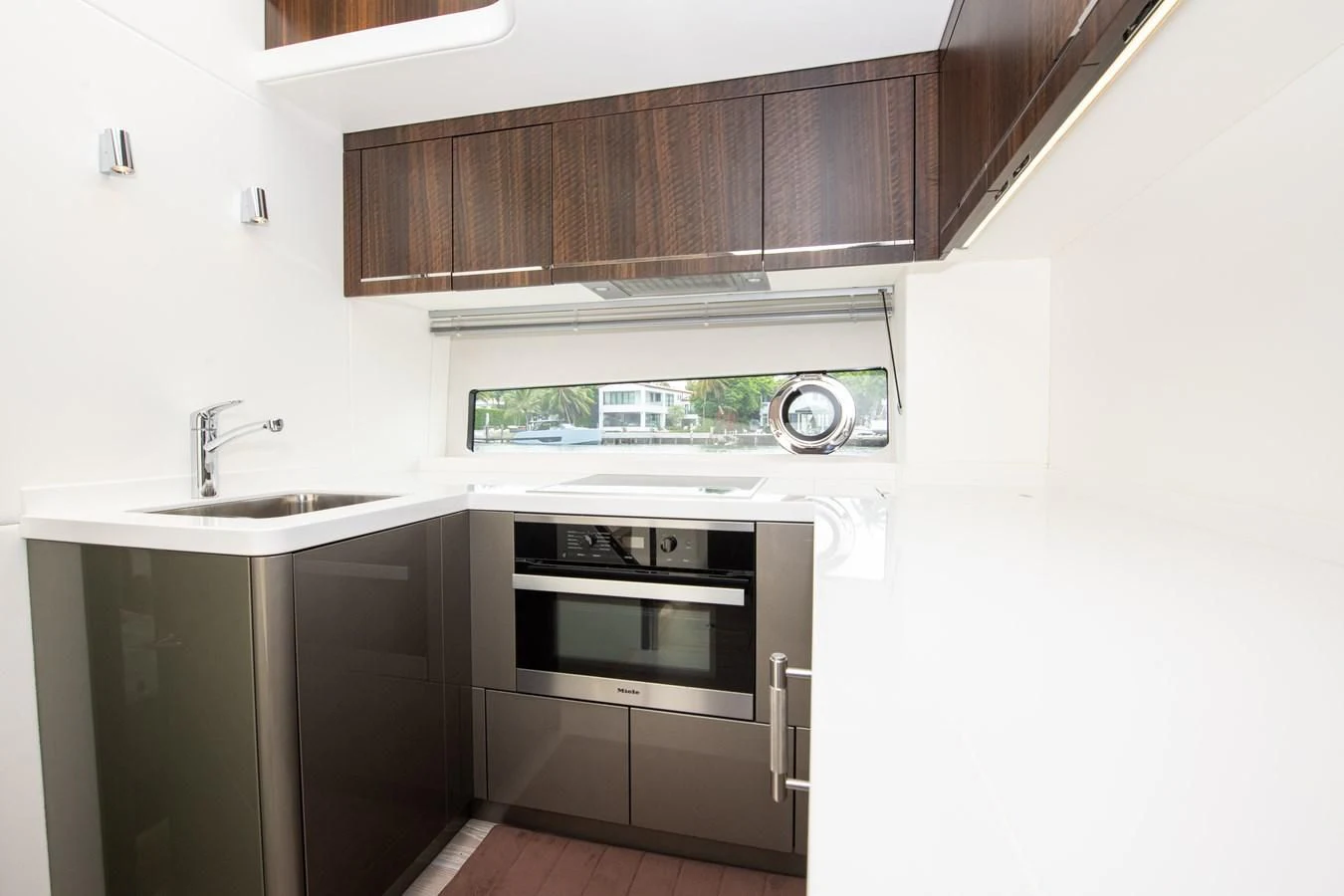 a kitchen with a sink and oven aboard INCENTIVIZED Yacht for Sale