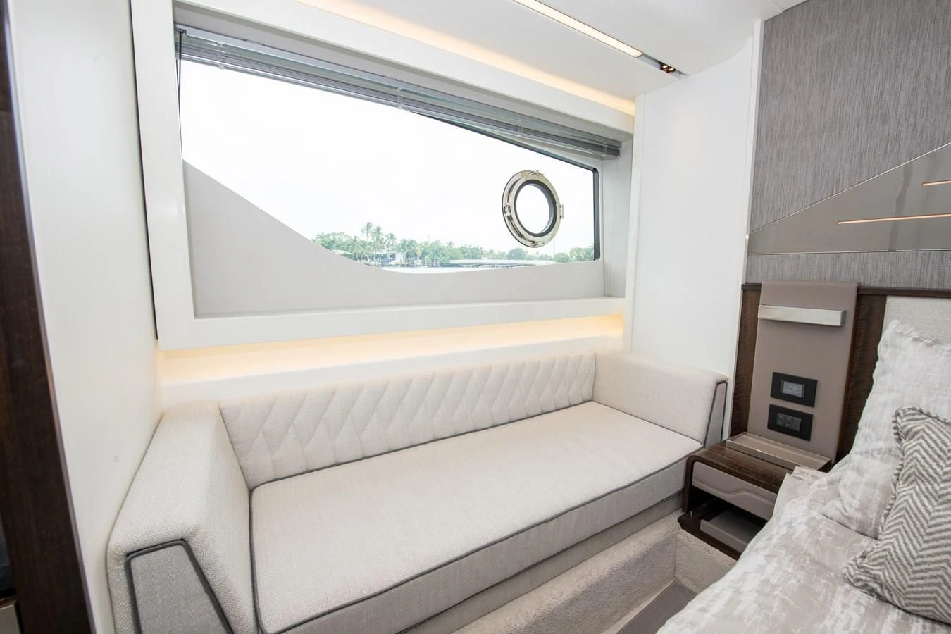 a white couch in a room aboard INCENTIVIZED Yacht for Sale
