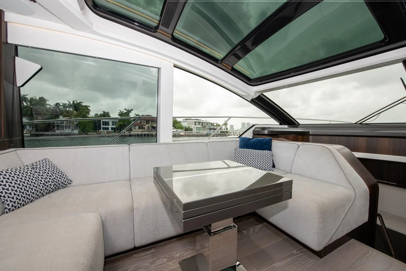 a room with couches and a table aboard INCENTIVIZED Yacht for Sale