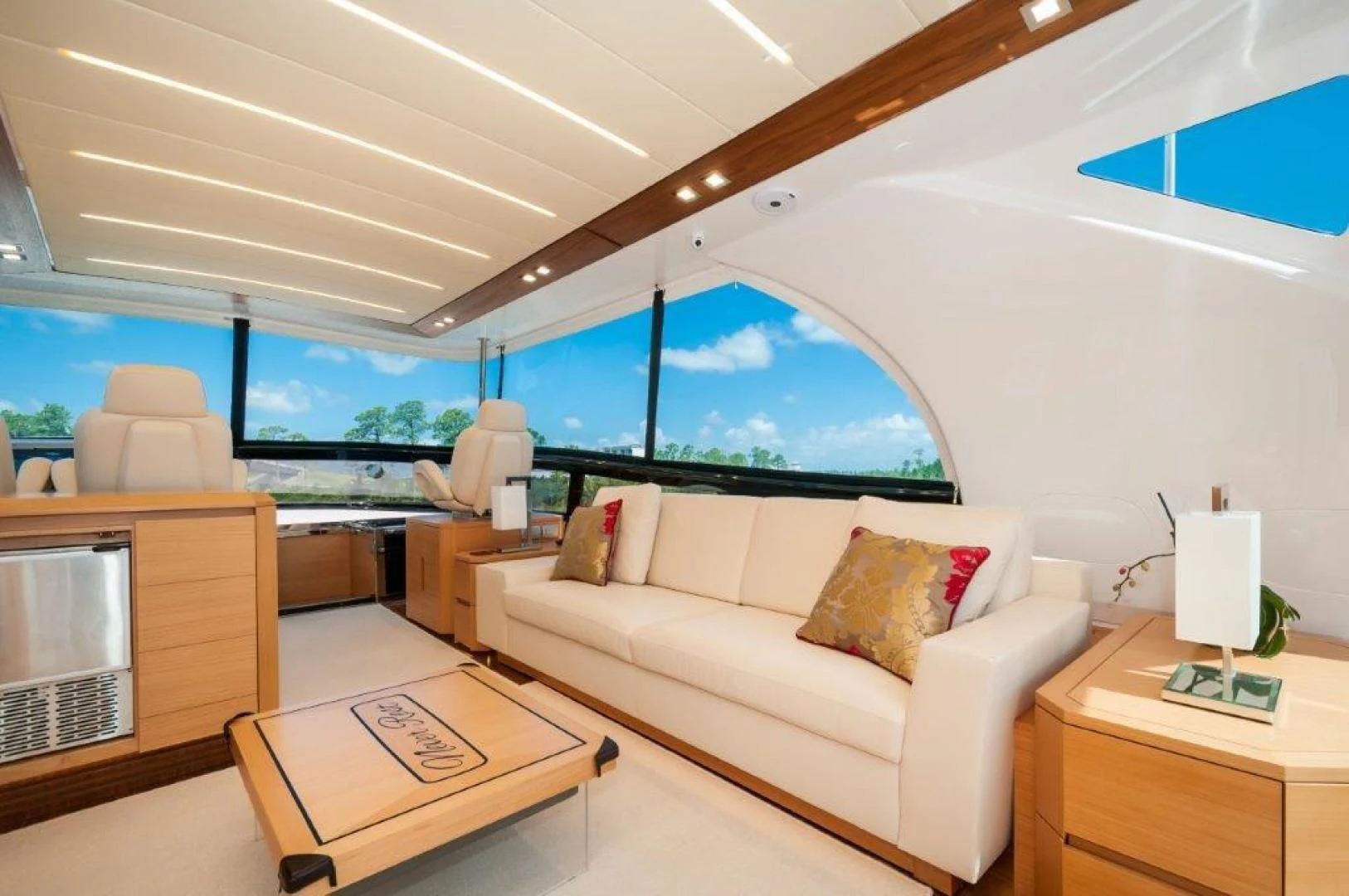 a living room with a large window aboard NEVER REST Yacht for Sale
