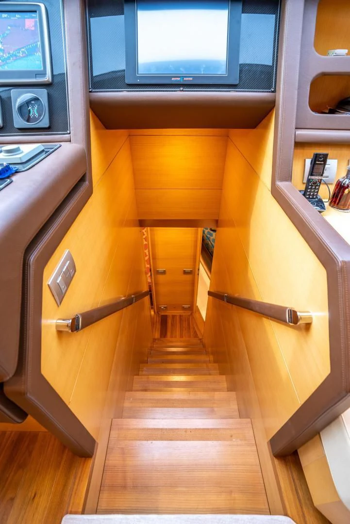 a wooden staircase in a room aboard NEVER REST Yacht for Sale