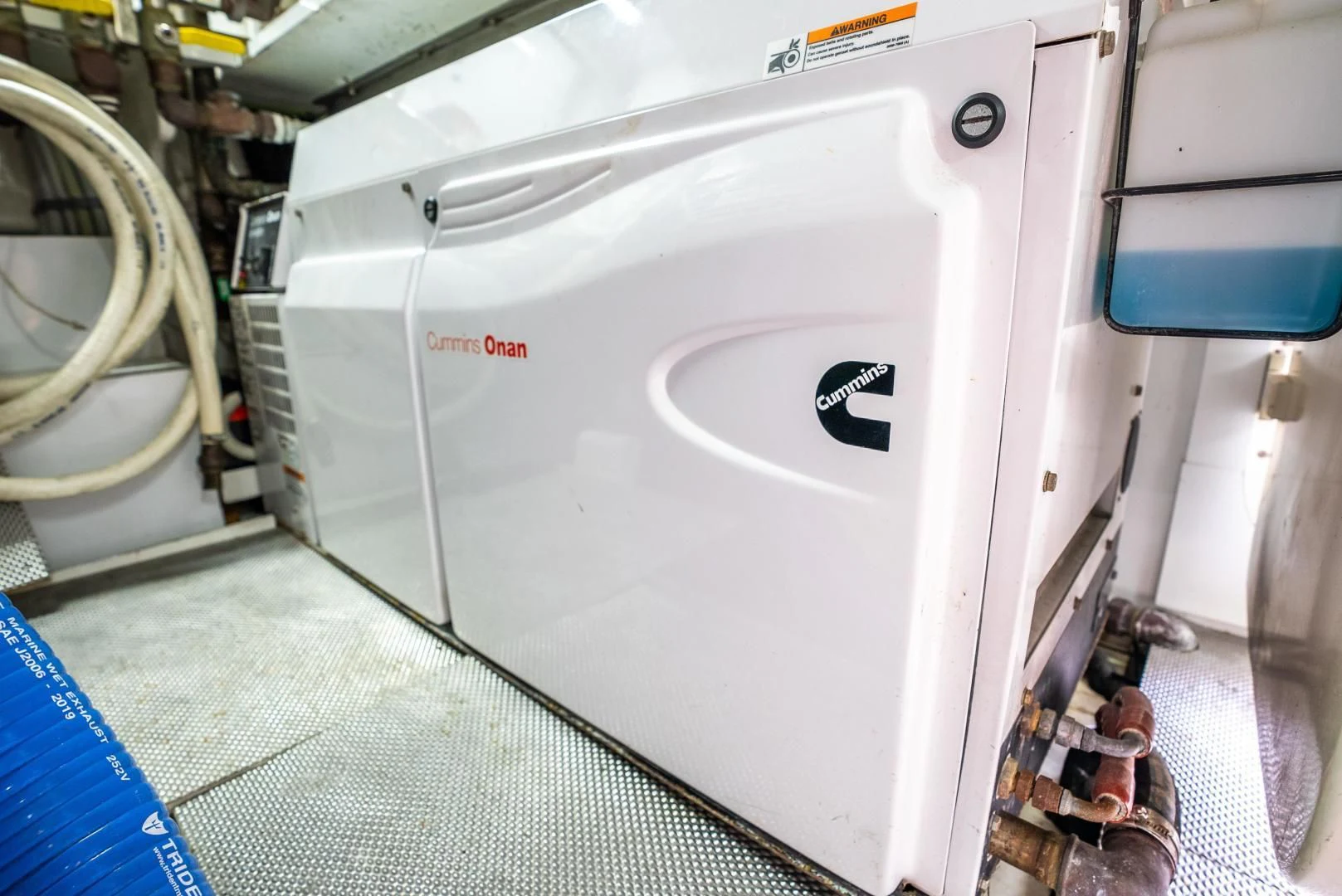 a white machine with a red label aboard NEVER REST Yacht for Sale