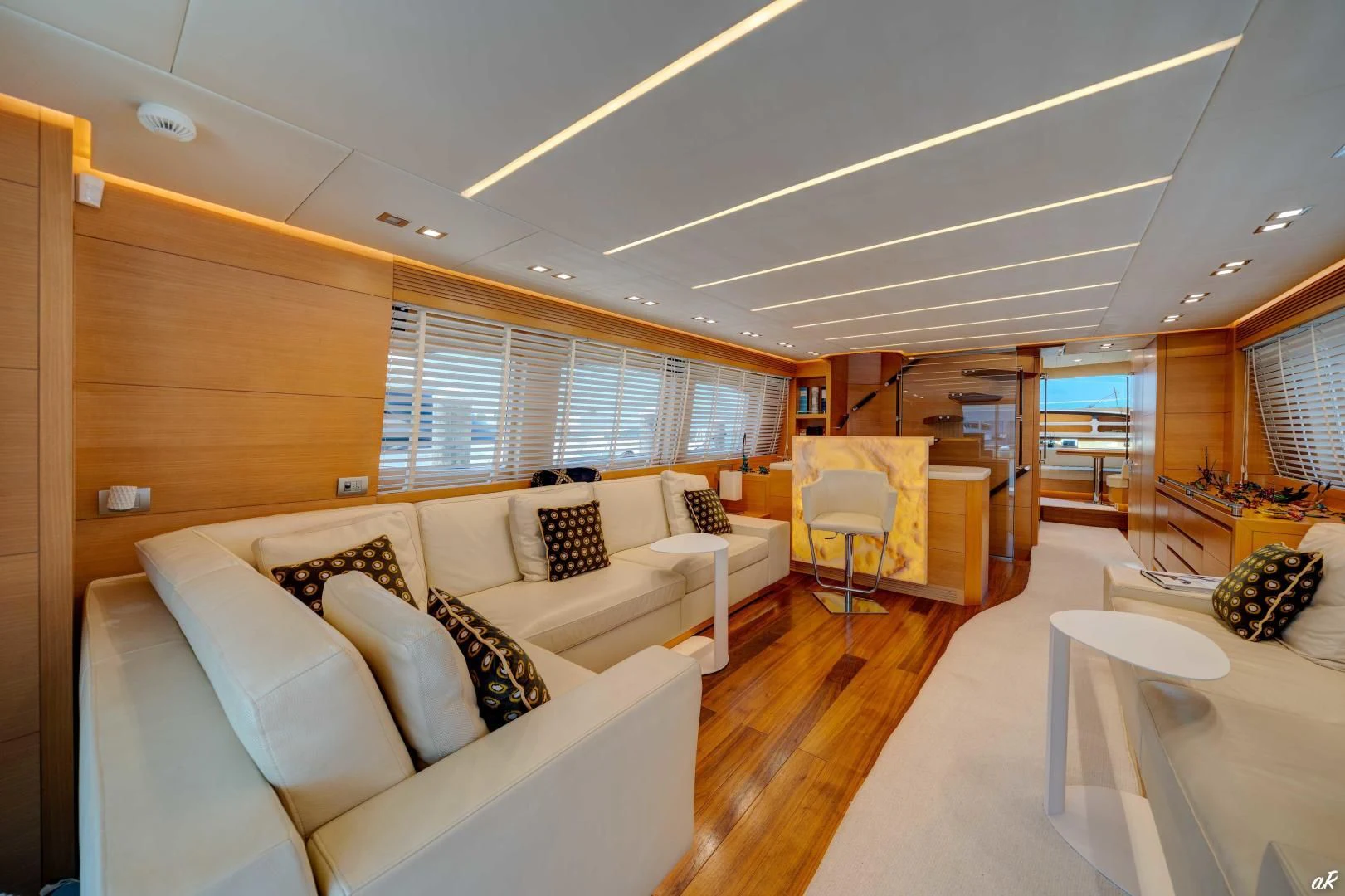 a living room with a couch and a table aboard NEVER REST Yacht for Sale