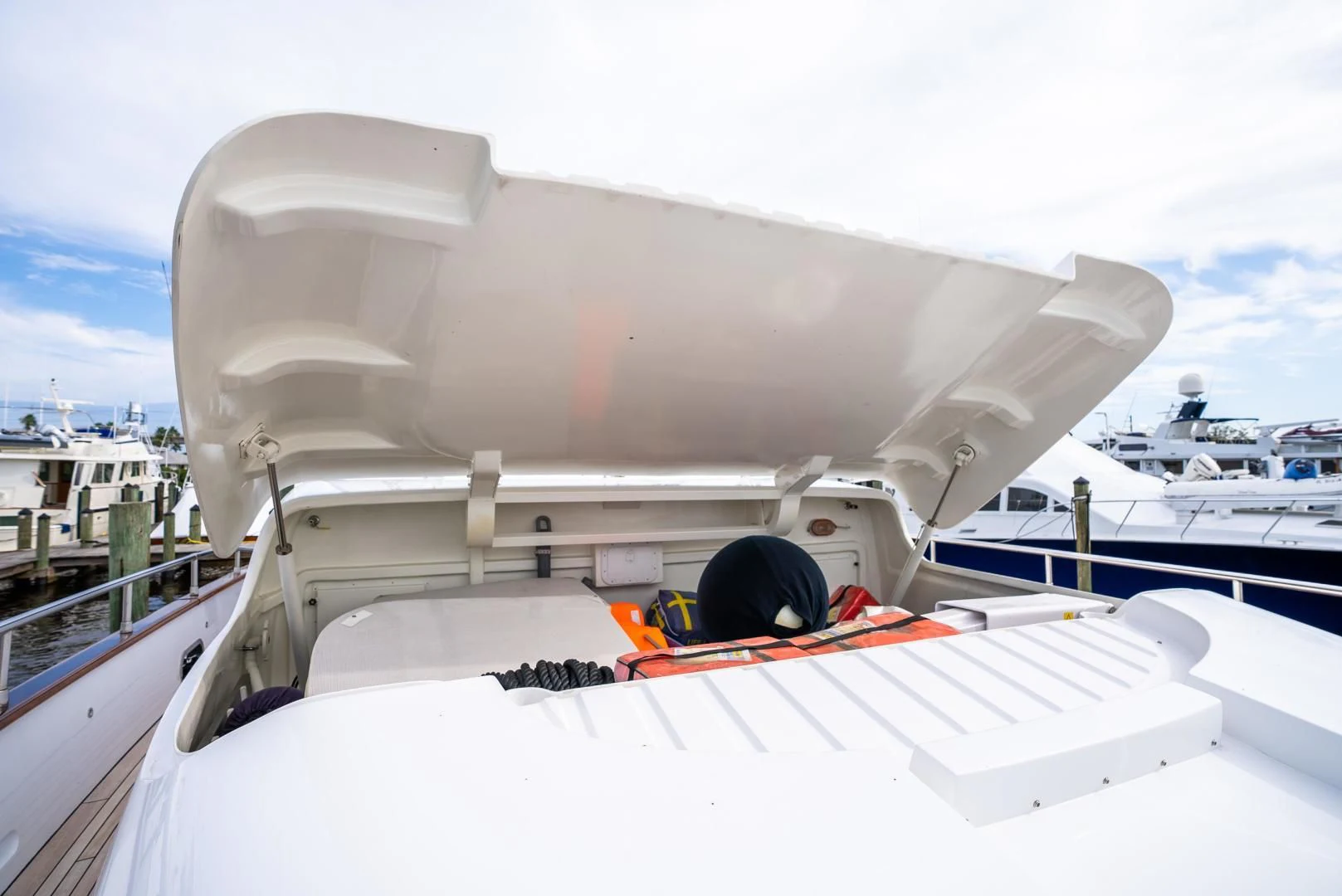 a white boat with a black tire aboard NEVER REST Yacht for Sale