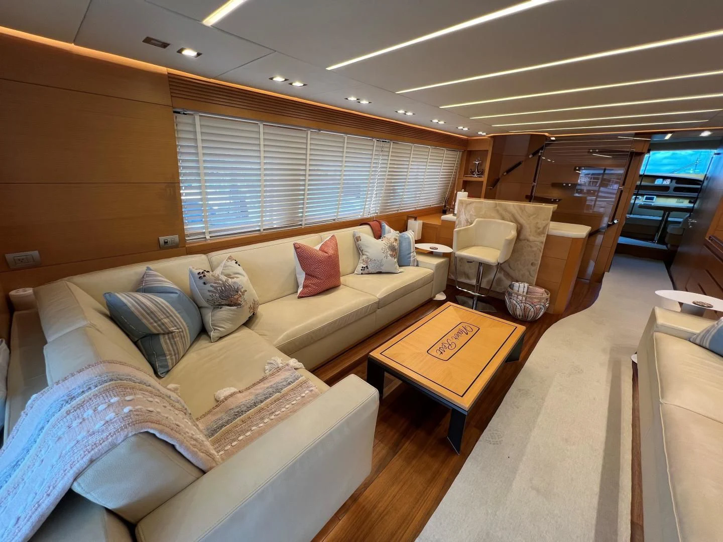 a living room with a couch and a coffee table aboard NEVER REST Yacht for Sale