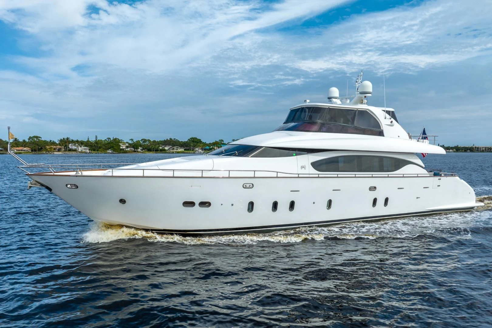a white yacht on the water aboard NEVER REST Yacht for Sale