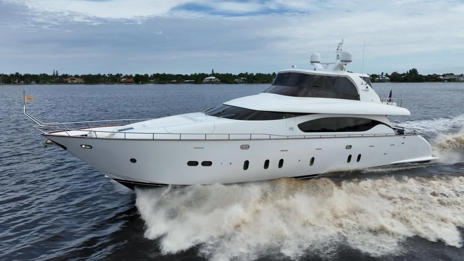 a white yacht on the water aboard NEVER REST Yacht for Sale