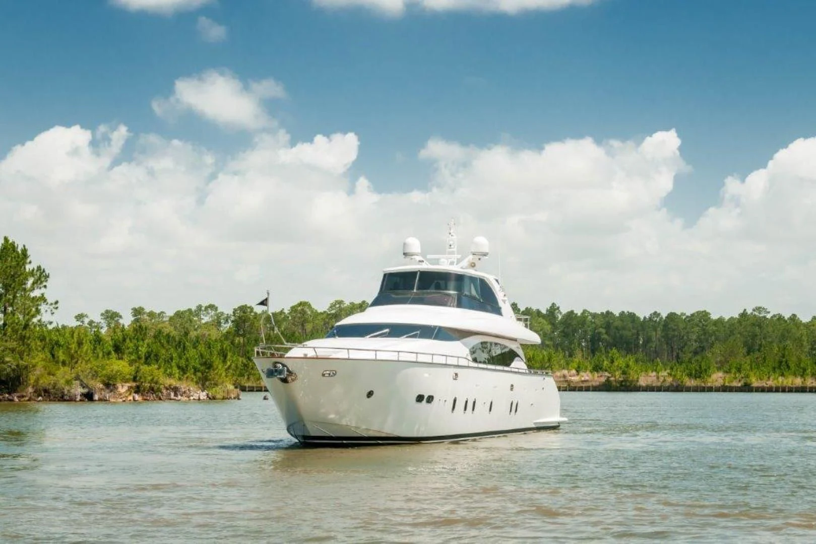 a white boat on the water aboard NEVER REST Yacht for Sale