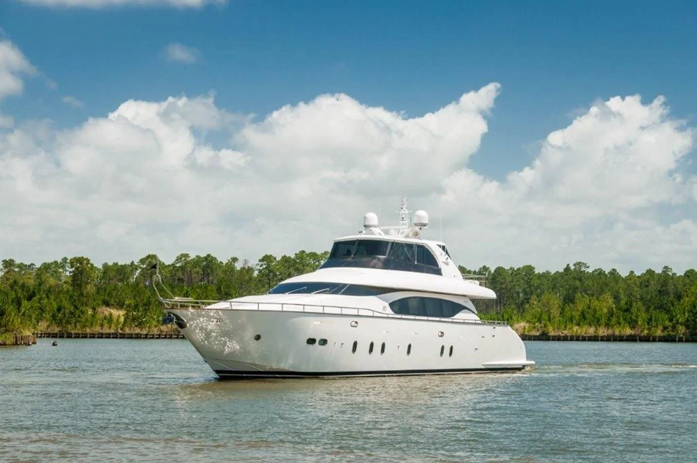 a white yacht on the water aboard NEVER REST Yacht for Sale