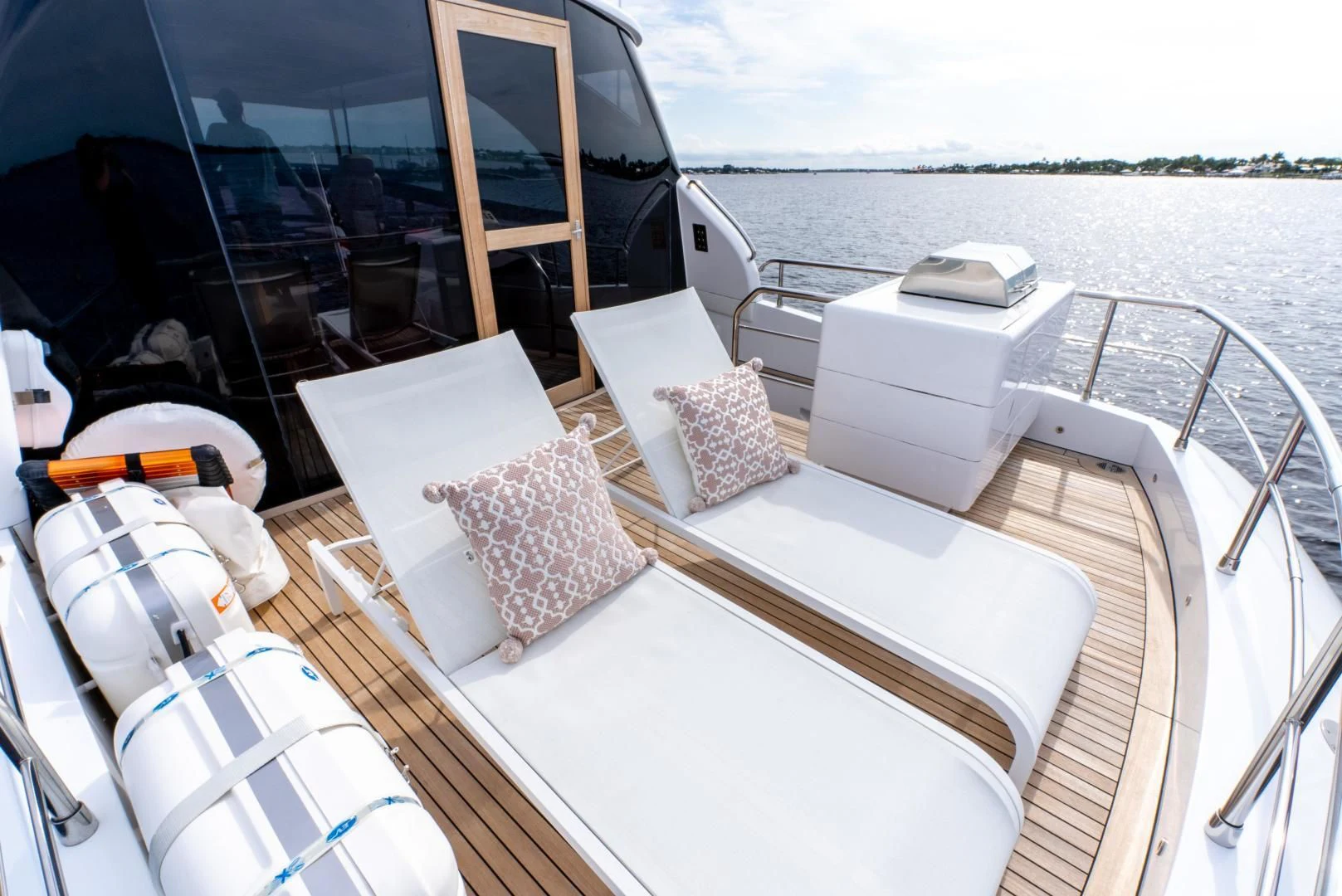 a boat with pillows on the deck aboard NEVER REST Yacht for Sale