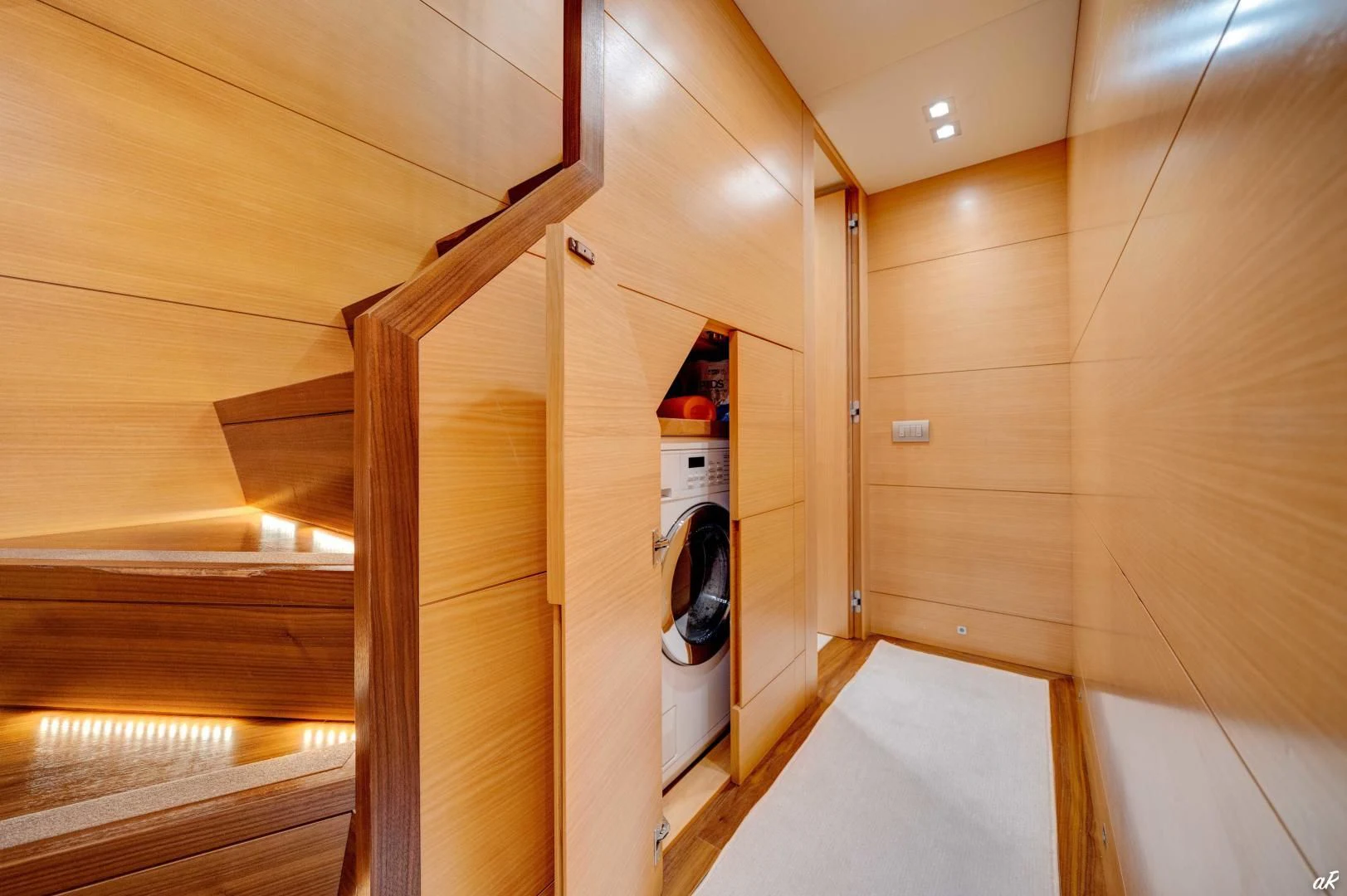 a room with wooden walls and a door open aboard NEVER REST Yacht for Sale