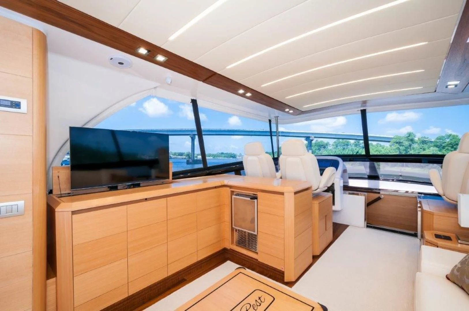 a room with a tv and a couch aboard NEVER REST Yacht for Sale