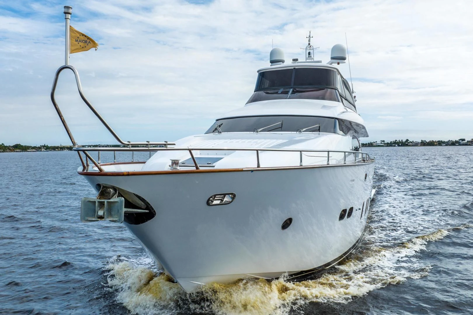a white boat on the water aboard NEVER REST Yacht for Sale