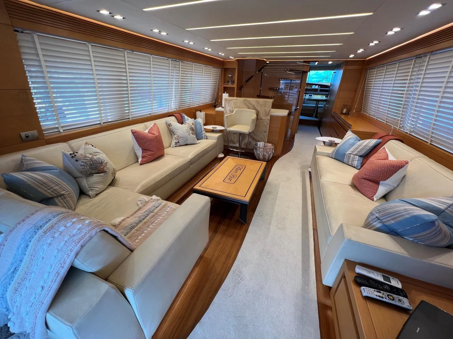 a living room with a couch and a coffee table aboard NEVER REST Yacht for Sale