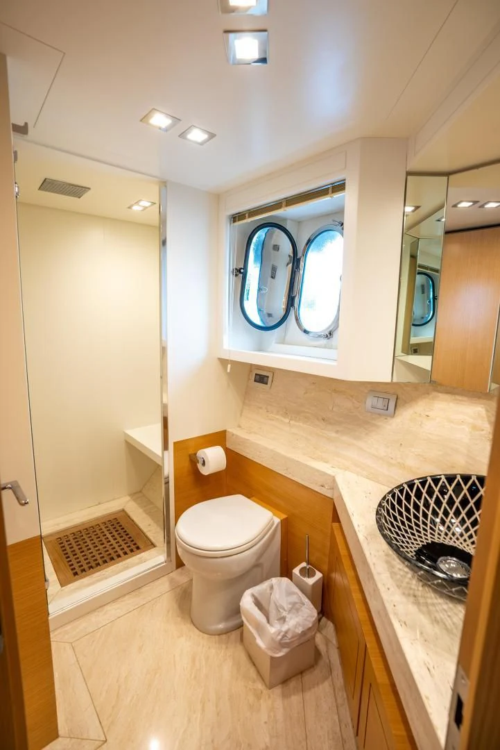 a bathroom with a toilet and a sink aboard NEVER REST Yacht for Sale