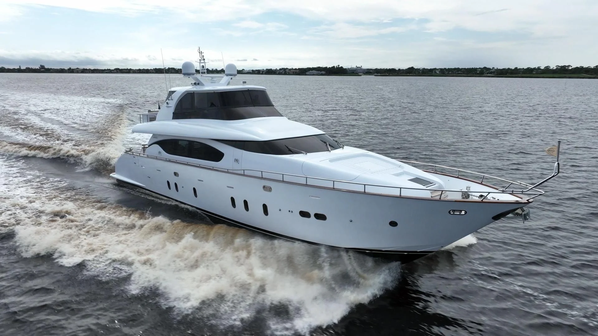a white yacht on the water aboard NEVER REST Yacht for Sale