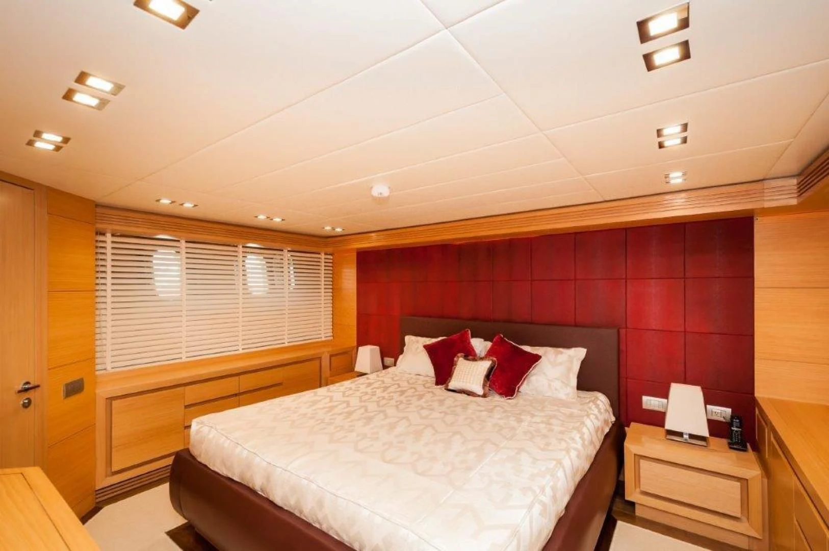 a room with a bed and a desk aboard NEVER REST Yacht for Sale