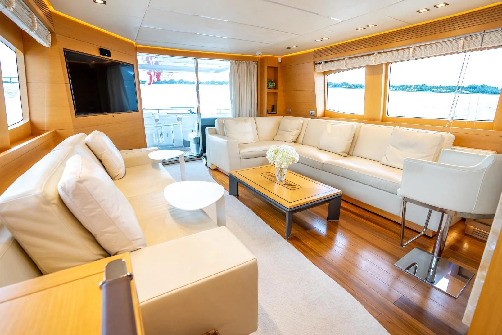 a living room with a couch and a coffee table aboard NEVER REST Yacht for Sale