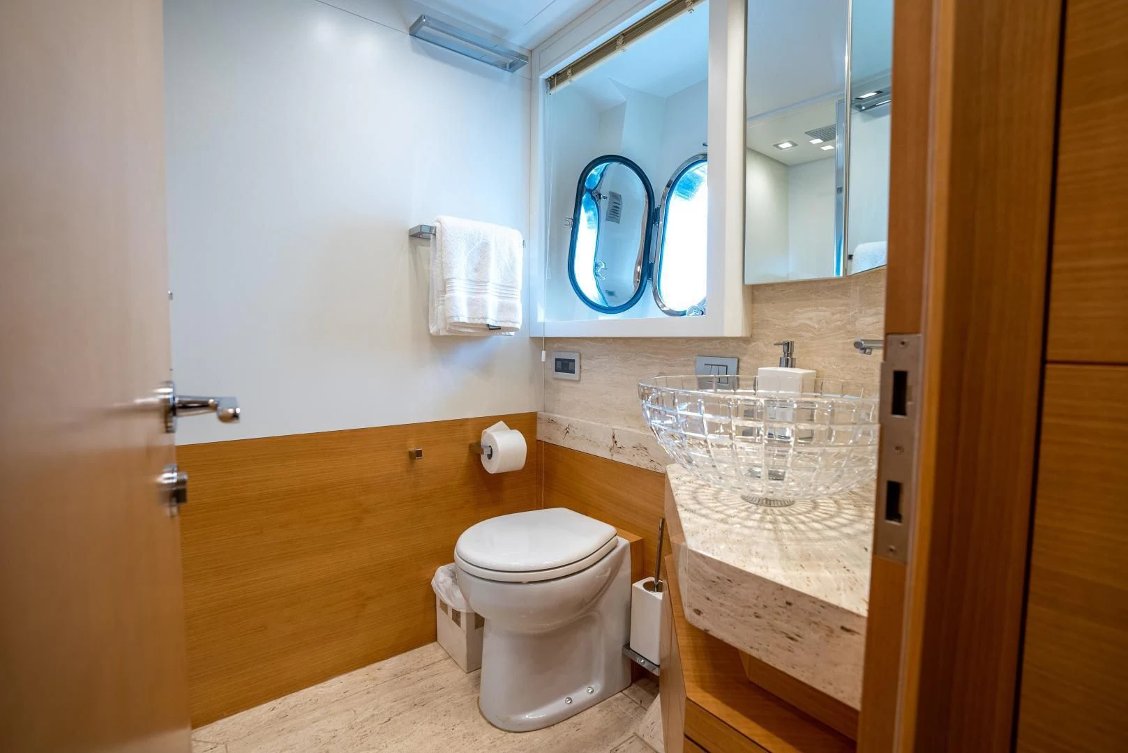 a bathroom with a toilet and a sink aboard NEVER REST Yacht for Sale