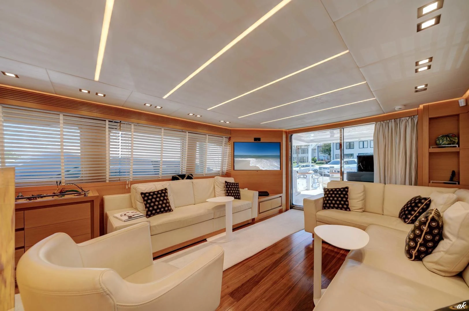 a living room with a couch and a table aboard NEVER REST Yacht for Sale